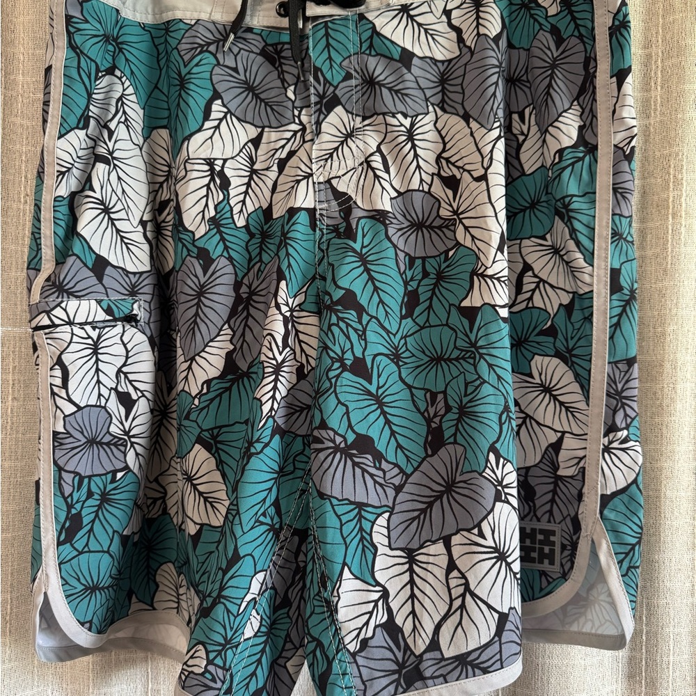 Hawaii’s Finest Kalo print board shorts in Teal, Gray & White